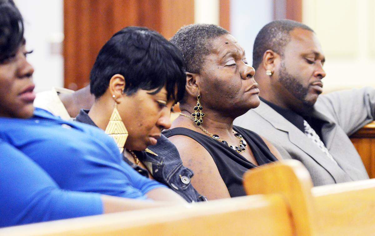 Family members of shooting victim Khalil Singleton, including Khalil’s father, Kareem Singleton, right, listen to closing arguments in the murder trial of Aaron Young Sr. on Wednesday at the Beaufort County Courthouse. Young Sr. is the last of three defendents to stand trial in the death of Singleton on Hilton Head Island on Sept. 1, 2012.