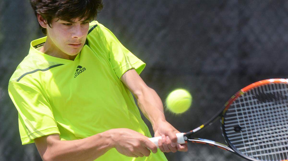 Blake Croyder hits a return during Monday's USTA?Southern?Level?1A Championships boys 14 singles final match with Drew Baird.