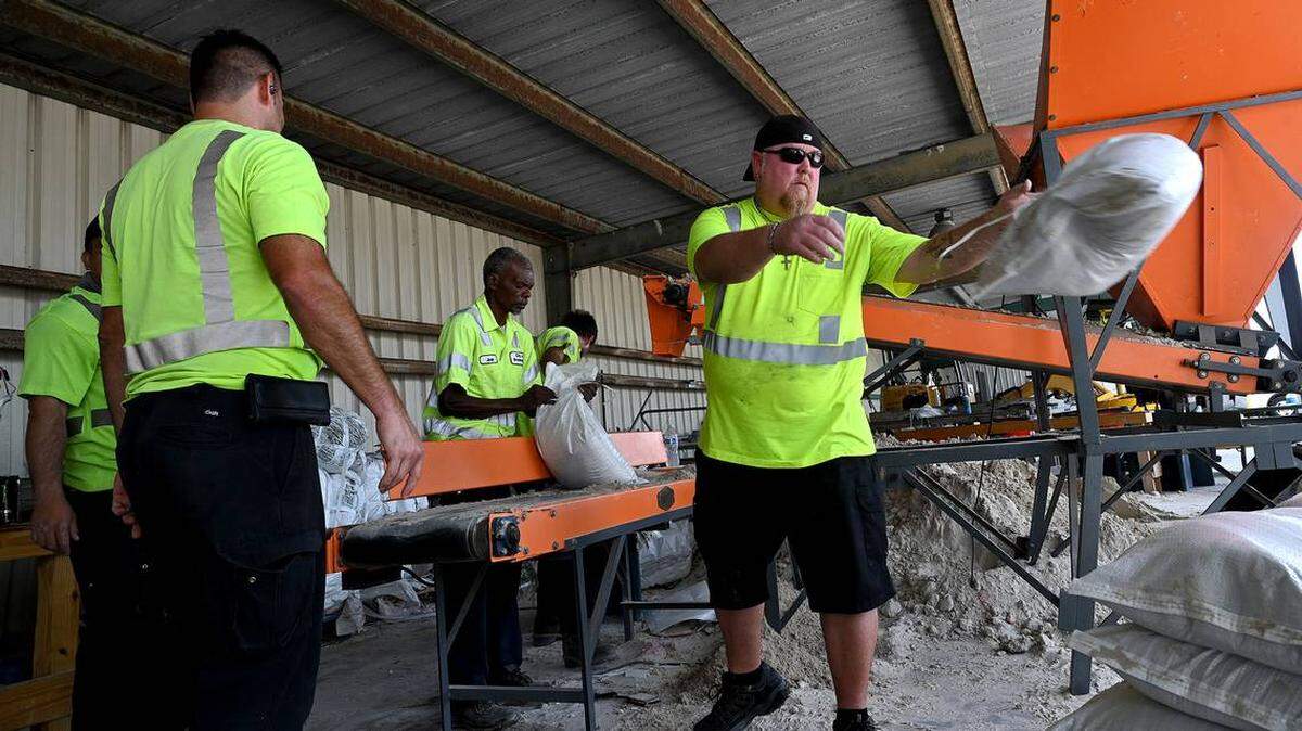 City of Bradenton, Fla. employees fill sandbags for residents in preparation for Idalia’s expected strengthening and approach on August 28, 2023.
