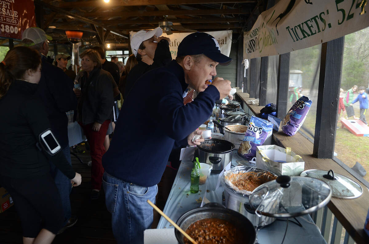 Mike Hostilo, one of the judges in the Chilly Bean 5K Run/Walk Chili Cook-off, tastes one of the submitted chilis in 2014 at the crab shack located in Coosaw Point on Lady’s Island. All proceeds from the event go to benefit Beaufort Academy.