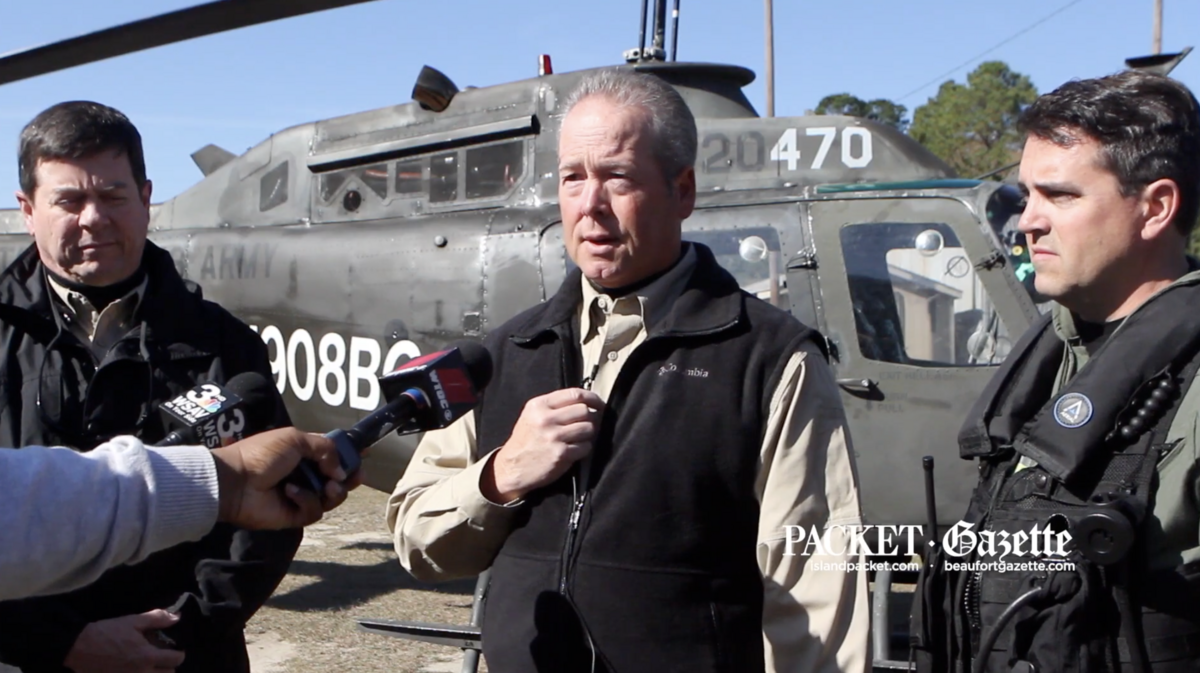 Beaufort County Sheriff P.J. Tanner speaks to reporters at a 2014 news conference introducing a Bell OH-58 Kiowa helicopter that his department acquired through a military surplus program.