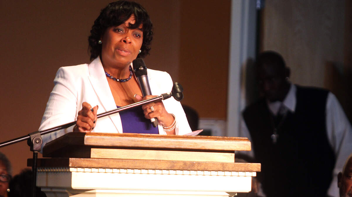 Olga "Loto" Williams, Dominique Williams' step-mother, tears up as she speaks during his funeral service on Saturday afternoon at Grace Community Church on Hilton Head Island.