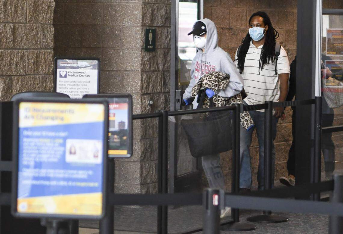 Passengers, many wearing masks and gloves for personal protection, arrive on Friday, March 27, 2020, at Hilton Head Airport on a mid-morning flight from Atlanta. Earlier in the week, Hilton Head Mayor John McCann thought those arriving from areas hit hard by the COVID-19 virus should be asked to self quarantine, which has not occurred.