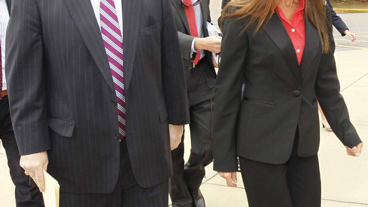 Rachel Duncan walks into the Matthew J. Perry US Courthouse with her lawyer, Greg Harris, left.