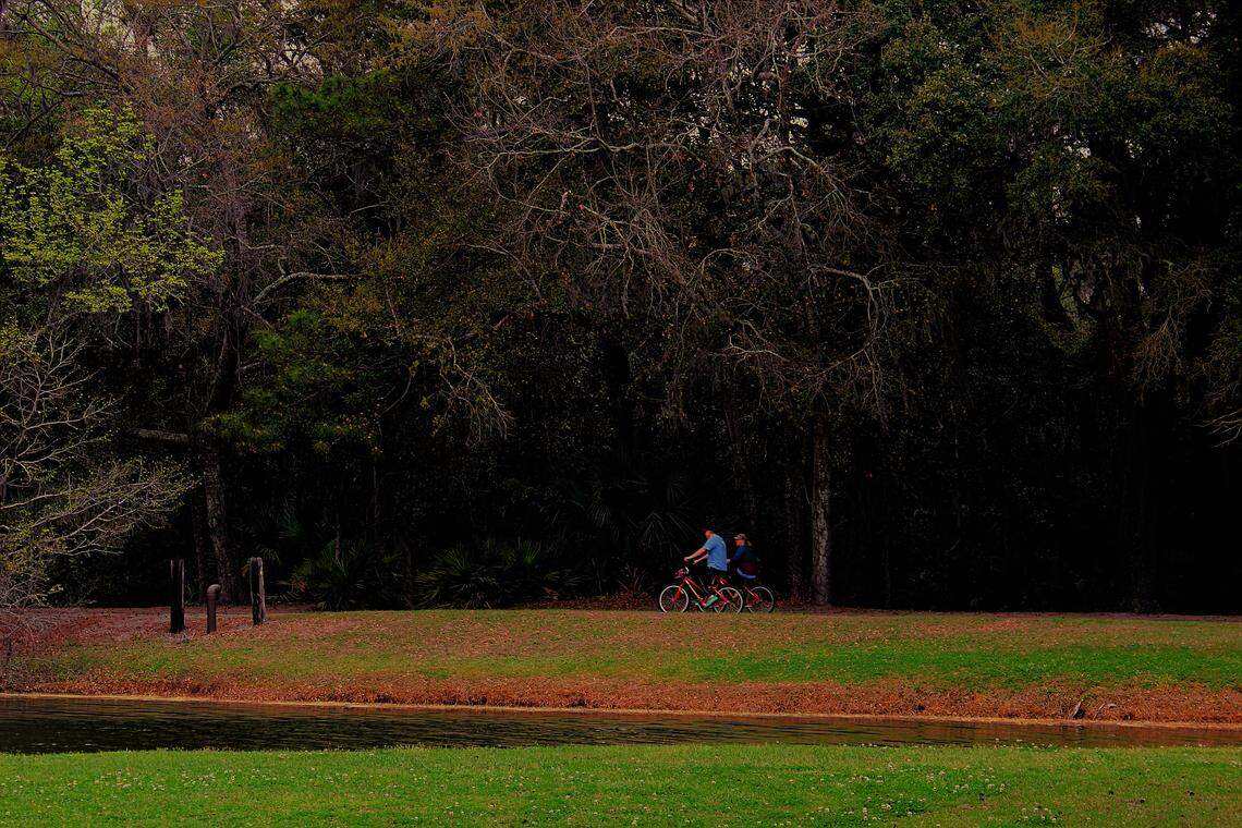 People bike through the Sea Pines Forest Preserve on March 12, 2026.