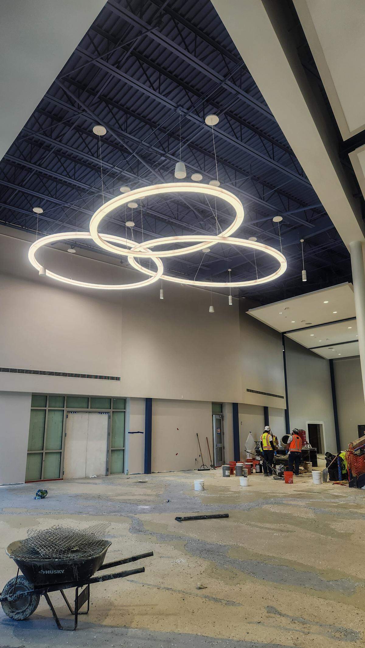 In the front lobby of the new Hilton Head Island High School, workers build a terrazzo floor of Hilton Head and its marshes as photographed on March 26, 2026, on Hilton Head. The Fine Arts building, located behind the far wall, will be renovated as part of the construction.