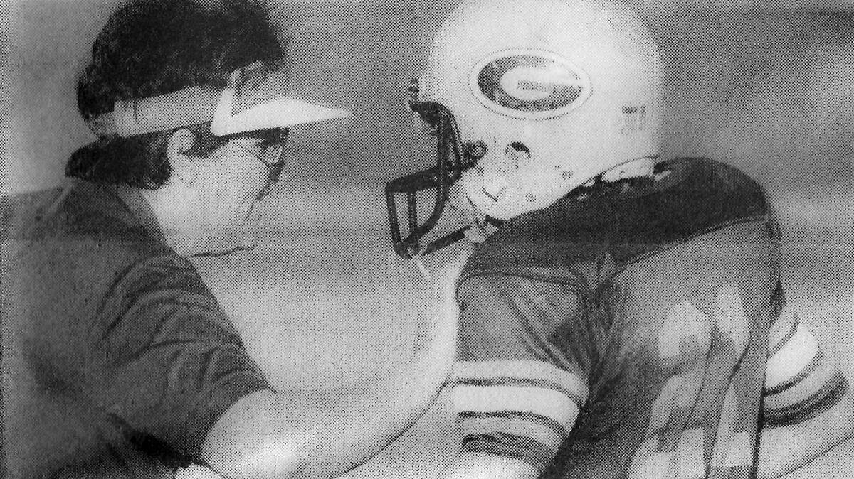 Head Coach Alicia Hack instructs a Hilton Head Gators player in a Pee Wee game against Laurel Bay in 1987.