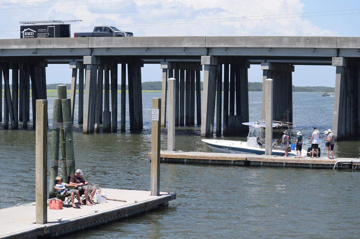 People enjoy the C.C. Haigh Jr. boat landing on Pinckney Island on Thursday, July 15, 2021.