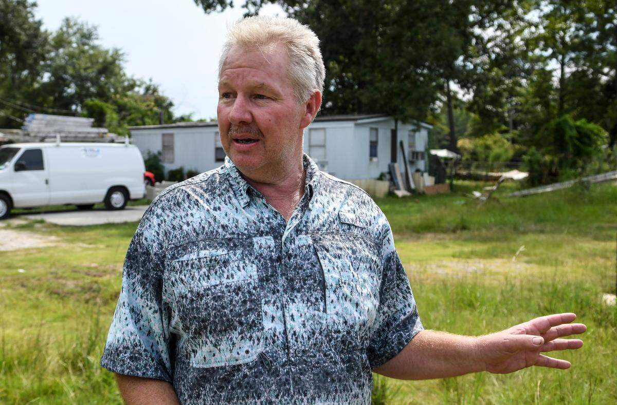 Hampton Lloyd, brother to Chandler Lloyd, owner of Able Contracting’s Material Recovery Center, tells a reporter on Thursday that he called 911 Wednesday night when Hampton Lloyd said Jasper County Fire-Rescue refused to put water on the smoldering pile of construction debris. Hampton, who owns land next to the recycling center, has tenants in mobile homes about 200 feet away from the toxic debris, one of whom is six months pregnant.