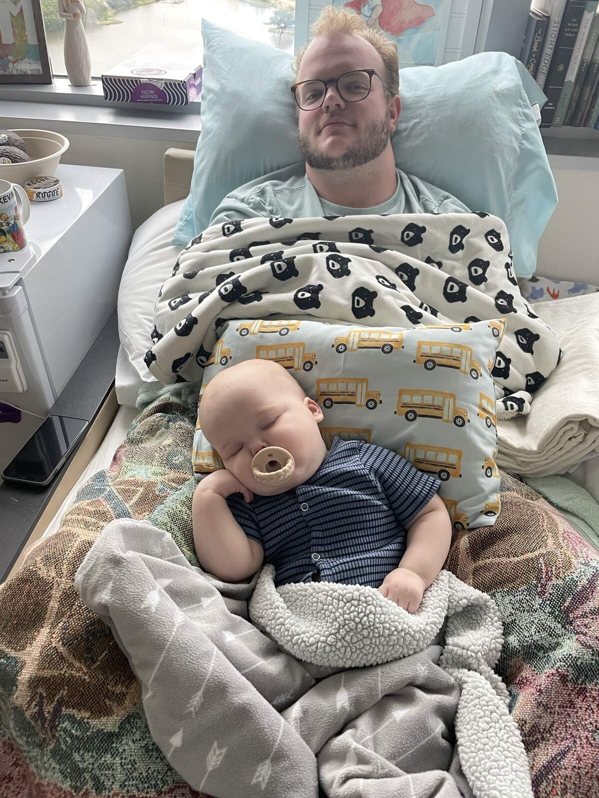 Crew Feltner snuggling with his dad Kevin Feltner.