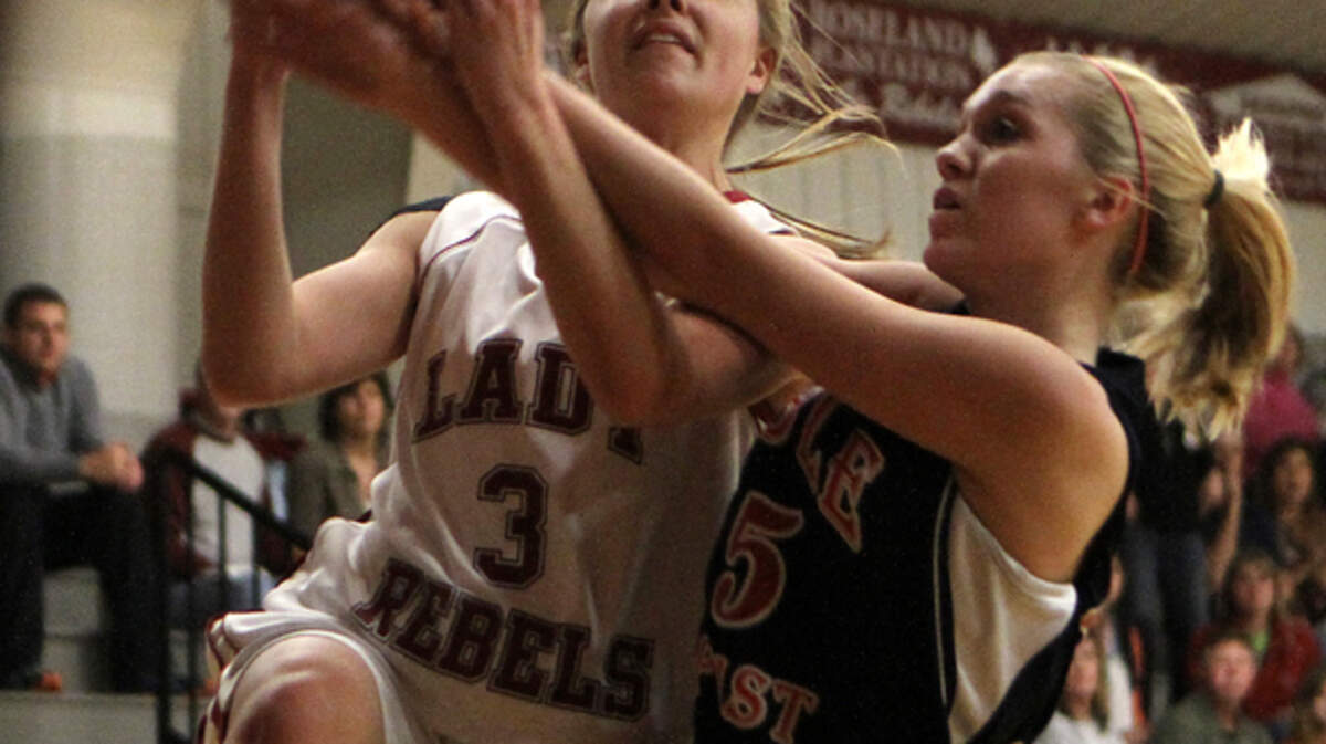 Thomas Heyward's Brielle Jungblut (3) is fouled by Bible Baptist's Caroline Bochette while going to the basket during the SCISAA Region 1-AA tournament in February. Jungblut will be playing in the SCISA vs. GISA all-star game today in Columbia.