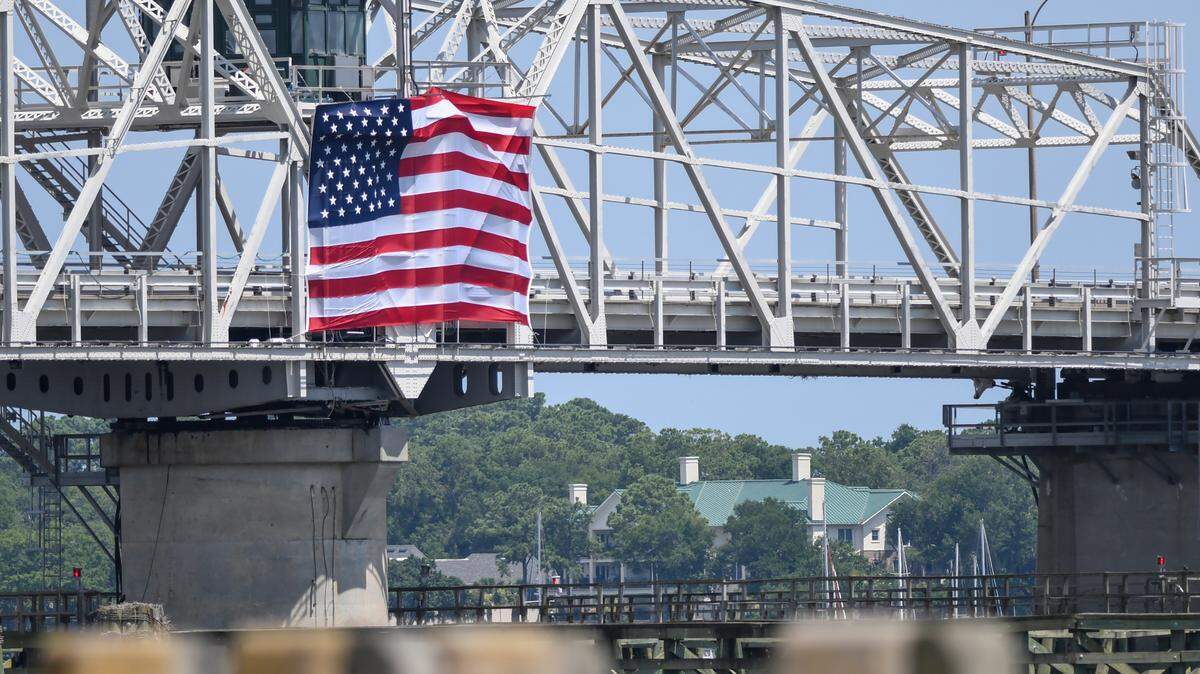 The City of Beaufort hoisted an American flag on the south side of the Richard V. Woods Memorial Bridge, which spans the Beaufort River, on the afternoon of Monday, June 29, 2020 in Beaufort’s historic downtown. This is the second year that the flag has flown from the bridge for the Fourth of July holiday weekend.