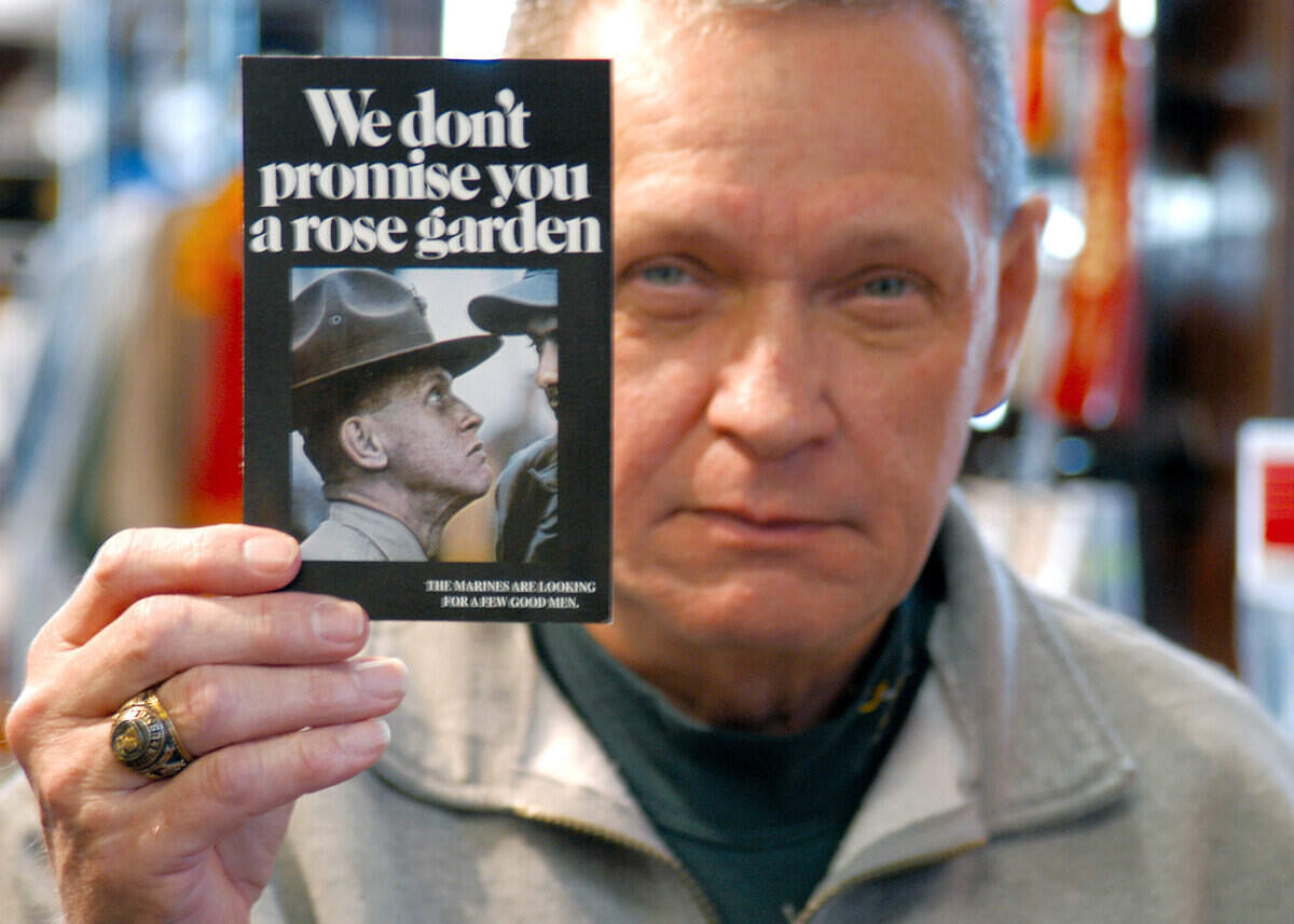 Charles Taliano, former drill instructor, held a smaller version of the poster that made him the face of Marine Corps recruiting in this 2006 photo.