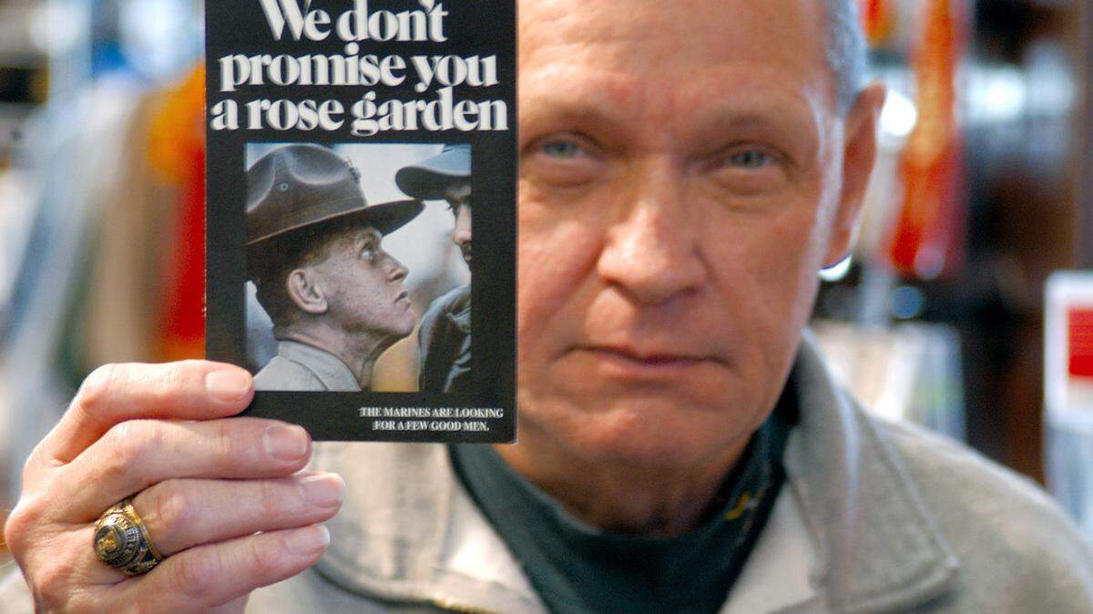 Charles Taliano, former drill instructor, held a smaller version of the poster that made him the face of Marine Corps recruiting in this 2006 photo.
