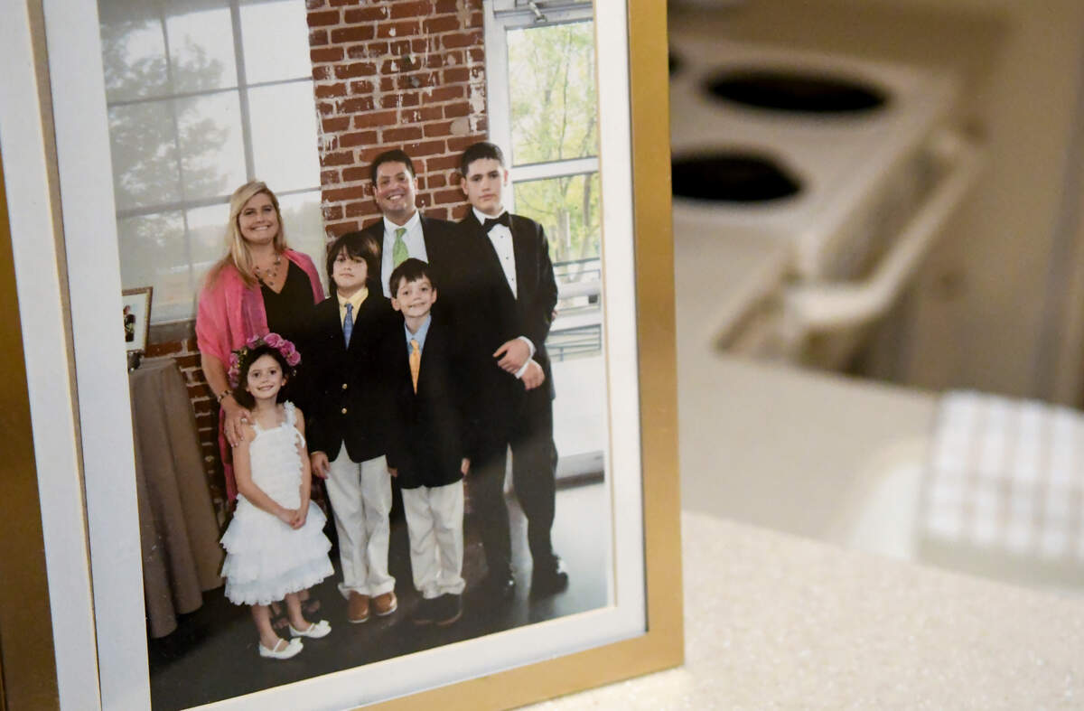 Pictured is the Arrieta family starting back left, clockwise: Caroline Arrieta, mother; Brandon Arrieta, father; and children Brandon Maxwell Arrieta, Alex Arrieta, Cotesworth “Cotesy” Daniel Arrieta and Leah Caroline Arrieta. The Arrietas lost Alex to acute myeloid leukemia when he was 10, and Cotesy died Tuesday morning at the age of 16. The family brought armfuls of photos from their home to a condominium because they couldn’t bear to stay at the home where Cotesy died.