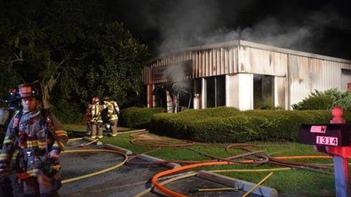 Bluffton Township Fire District firefighters work at the scene of a fire that damaged the Salvation Army building on US 278 in Bluffton around 5 a.m. Sept. 6, 2015.