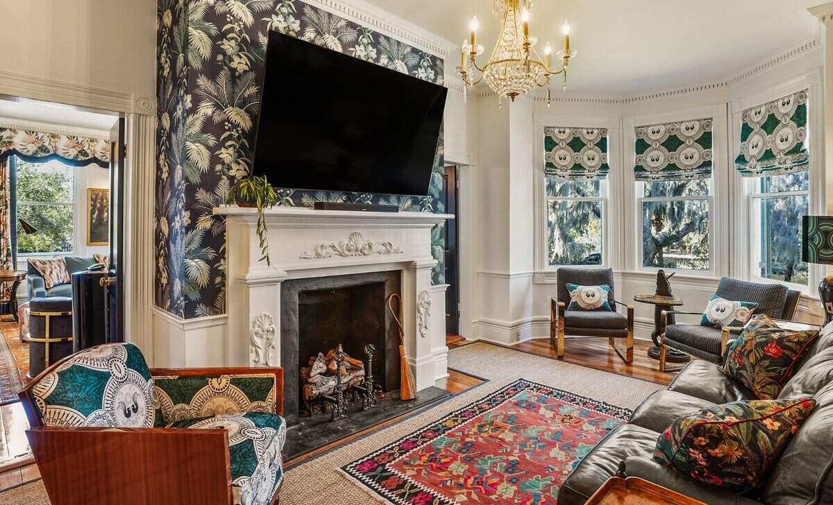 The second living room is separated from the first living room by a fireplace.