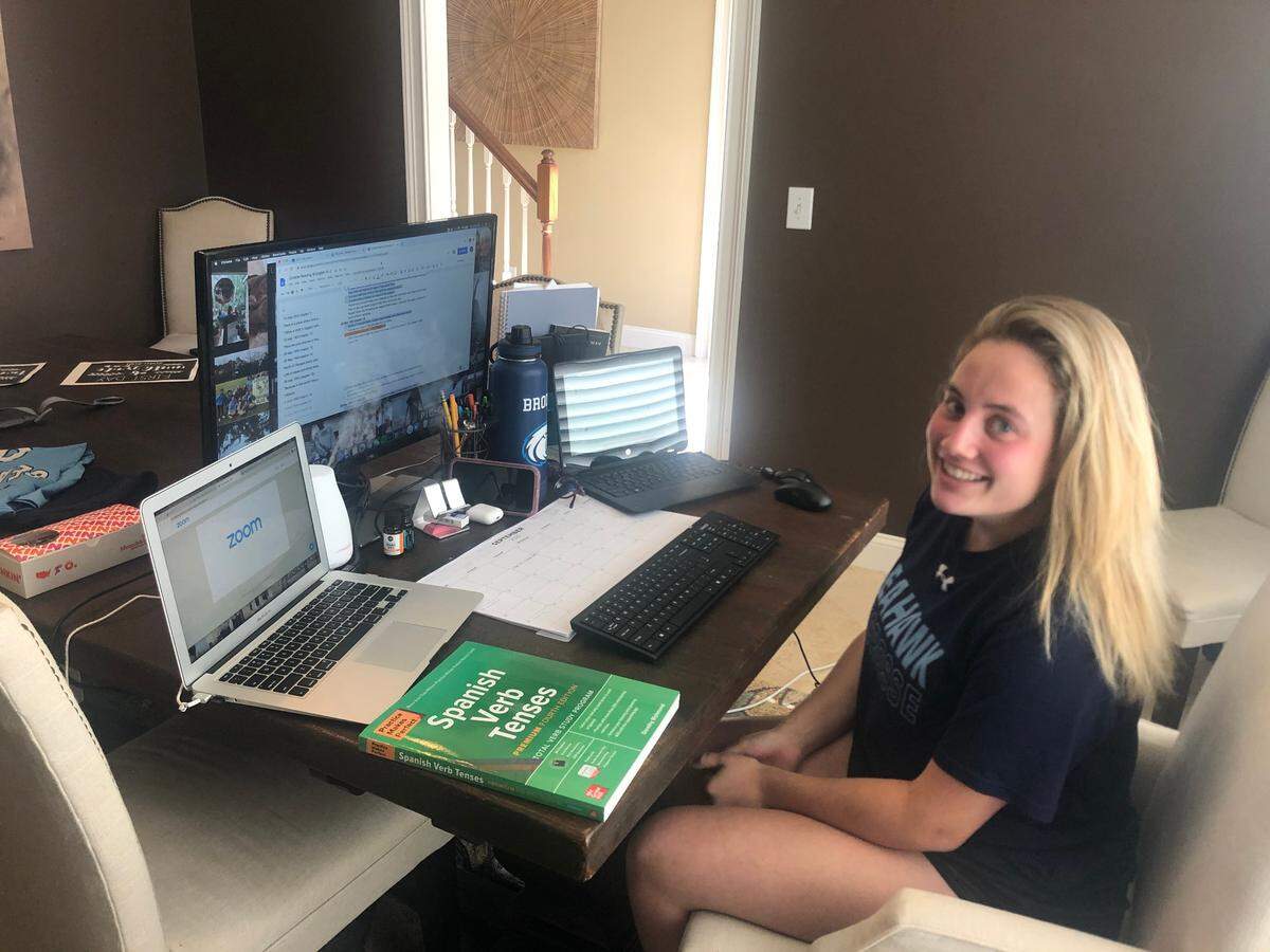 Brooke Simons at her family’s dining room table on her first day of senior year at Hilton Head High School. She opted for face-to-face classes but is starting the year virtually.