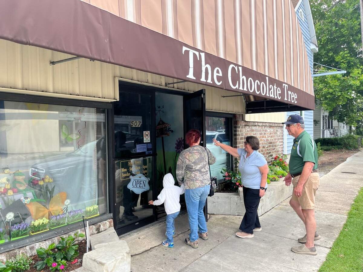 Customers file into The Chocolate Tree on Carteret Street in Beaufort during the last day of business for the store in May 2025. Now the shop is being reopened.