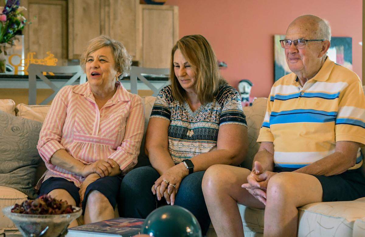 Marsha Mathews of Haslet, Texas, from left, sits with her half sister Jill Ortago of Puryear, Tenn., at their uncle Max Clements’ home in Sun City Hilton Head on Tuesday morning after a DNA search linked the three together. Clements brother, James Doy Clements, who has since died, was the father of the two women who recently learned of each other through DNA.