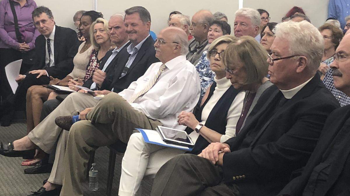 The six candidates for Hilton Head mayor seated next to members of the Lowcountry Coalition Against Hate at a forum on Tuesday, Oct. 30. From far left, the candidates are Michael Santomauro, Rochelle Williams, Kim Likins, John McCann, Alan Perry and Barry Ginn.
