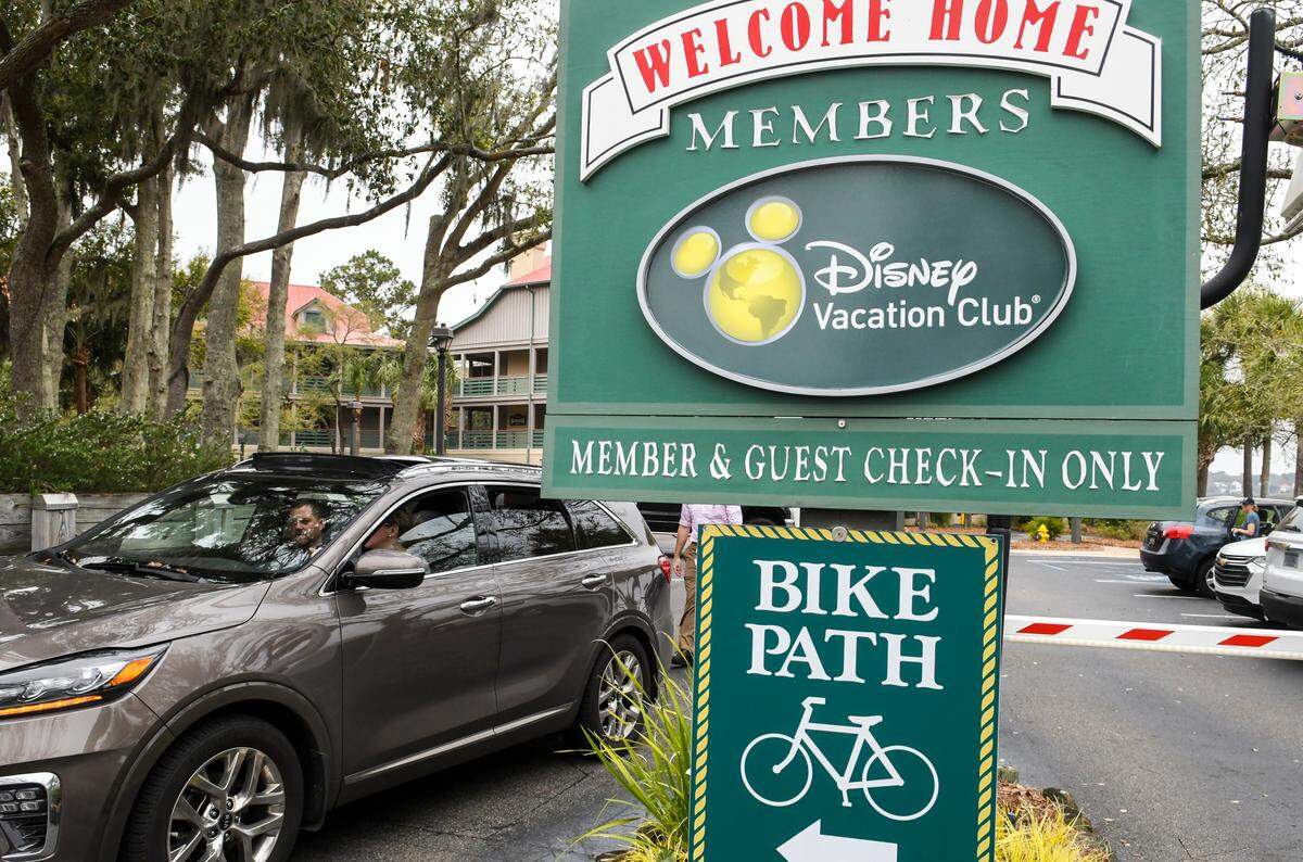 A vehicle leaves the Hilton Head Island Disney Vacation Club on Wednesday, March 18, 2020 on the day of S.C. Gov. Henry McMaster’s closure of bars and restaurants to help stop the spread of COVID-19 virus. A spokesperson said all of Disney properties will close on Friday due to the coronavirus.