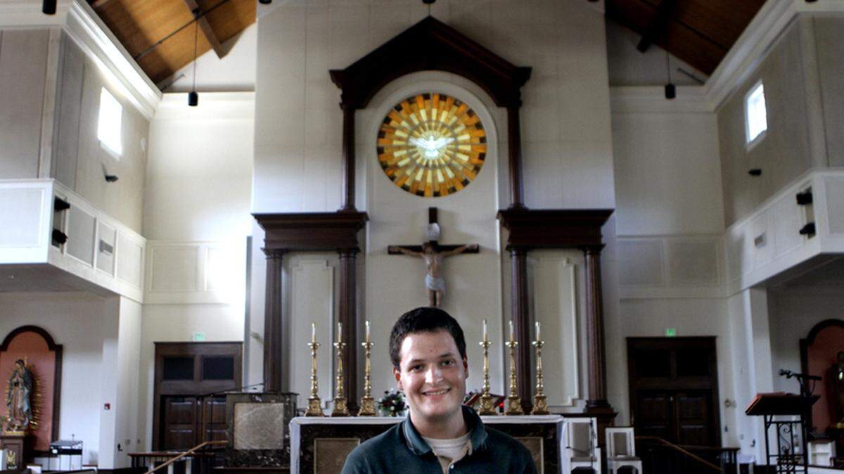 Paul Lacombe of Beaufort poses for a portrait at St. Peter Catholic Church on Lady's Island. Lacombe is a current seminarian living in Charleston and he is preparing to go to seminary school.