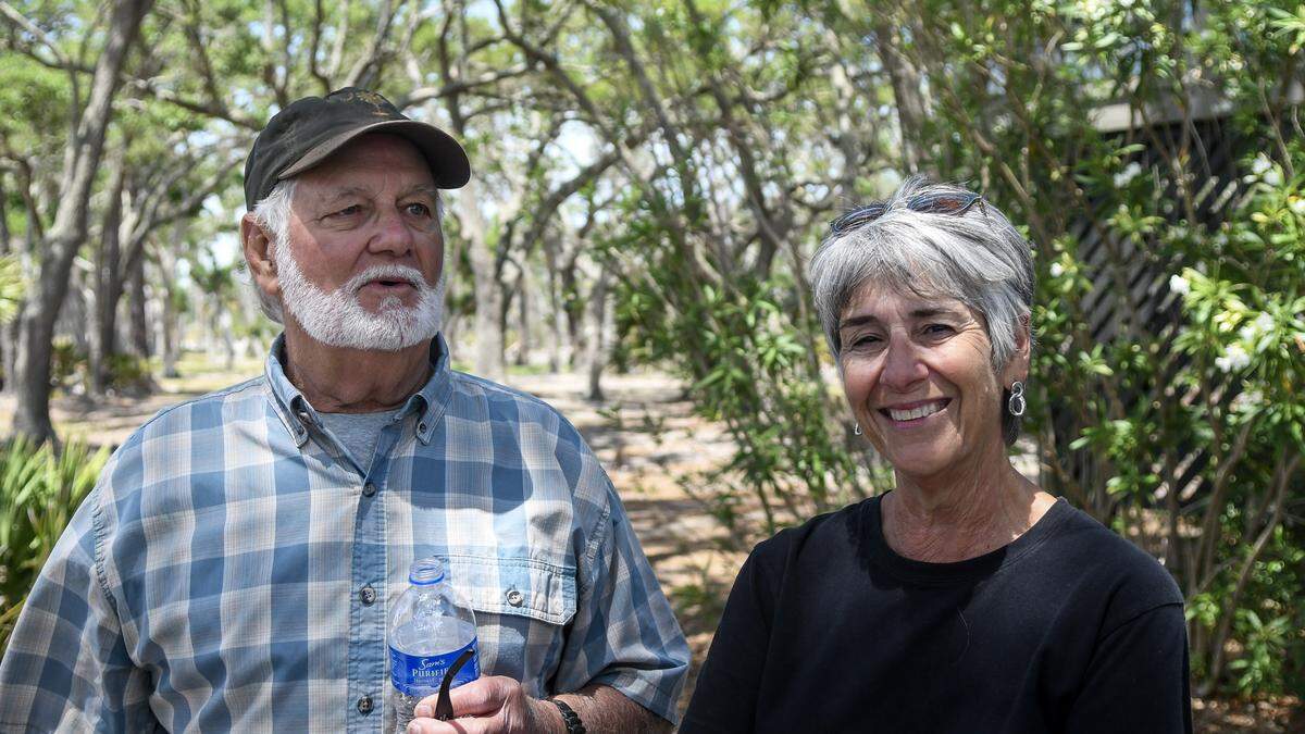 Boogie Tudor, left, and his wife Jo Tudor, reminisce about the times they spent with Ted Turner, his family and friends on May 8, 2026, on St. Phillips Island. Boogie was Turner’s right-hand man, cutting trails through the dense vegetation of the 4,680-acre barrier island; finding a suitable location to build Turner’s home; and figuring out a way to bring power and water to the island after first building a caretakers house where the Tudors would reside.