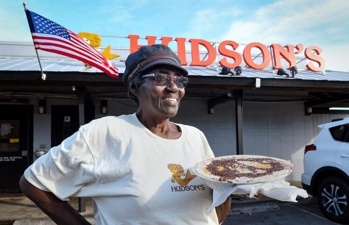 Bessie Orage is photographed with one of her peanut butter pies outside Hudson’s Seafood House on the Docks on Hilton Head in 2018.