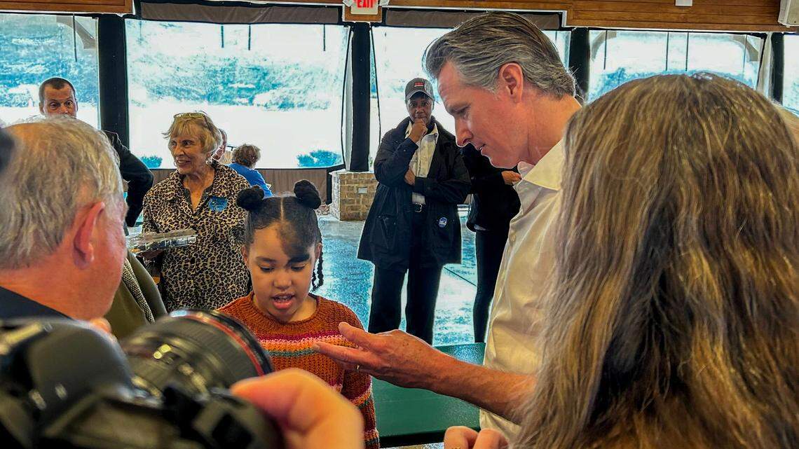 After campaigning for President Joe Biden, California Gov. Gavin Newsom talks with Emrys Young on Jan. 24, 2024, at Sun City Hilton Head in Okatie, S.C.