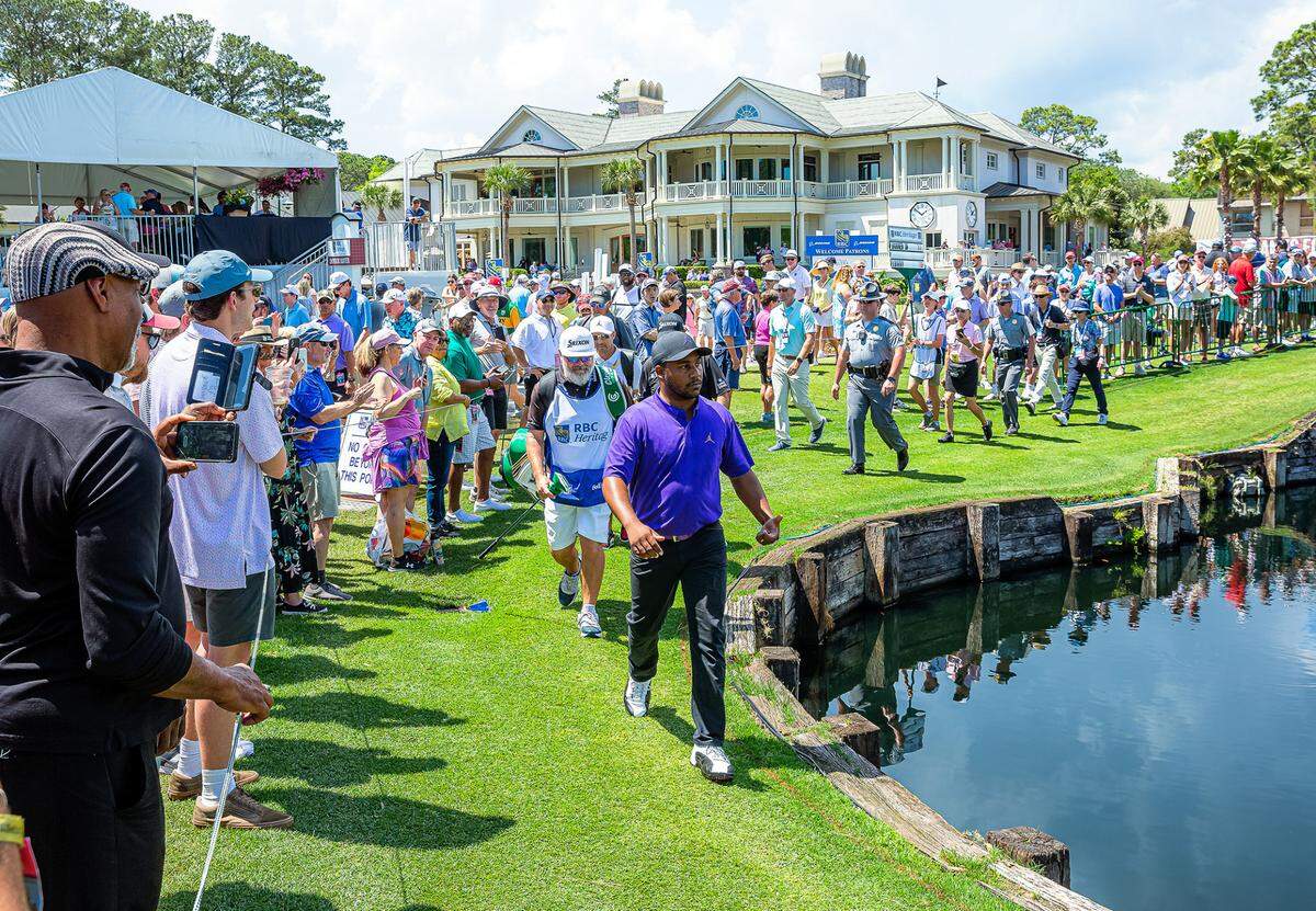 Attendees at the RBC Heritage Presented By Boeing watch as Harold Varner III makes his way to start his round during the final day of tournament play on Sunday, April 17, 2022 at Harbour Town Golf Links in Sea Pines on Hilton Head Island.