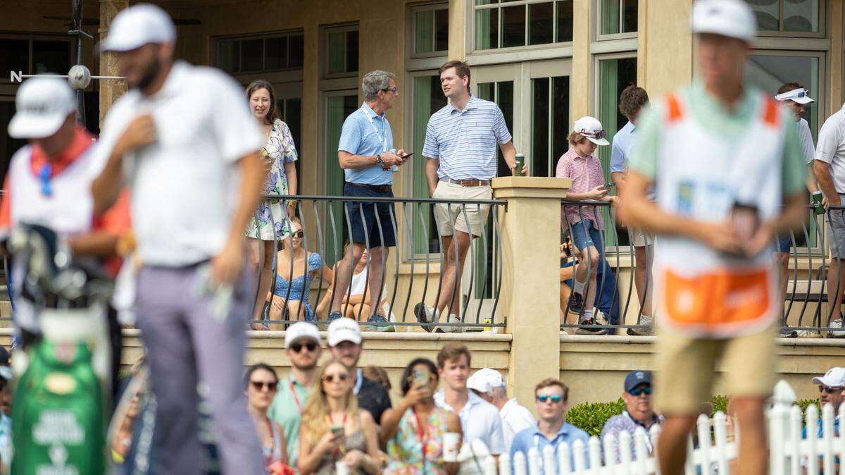 Spectators observe the world’s top ranked golfer, Scottie Scheffler, prepare to tee off from the 17th hole during the third round of the RBC Heritage Presented by Boeing at Harbour Town Golf Links on Saturday, April 20, 2024 in Sea Pines on Hilton Head Island.