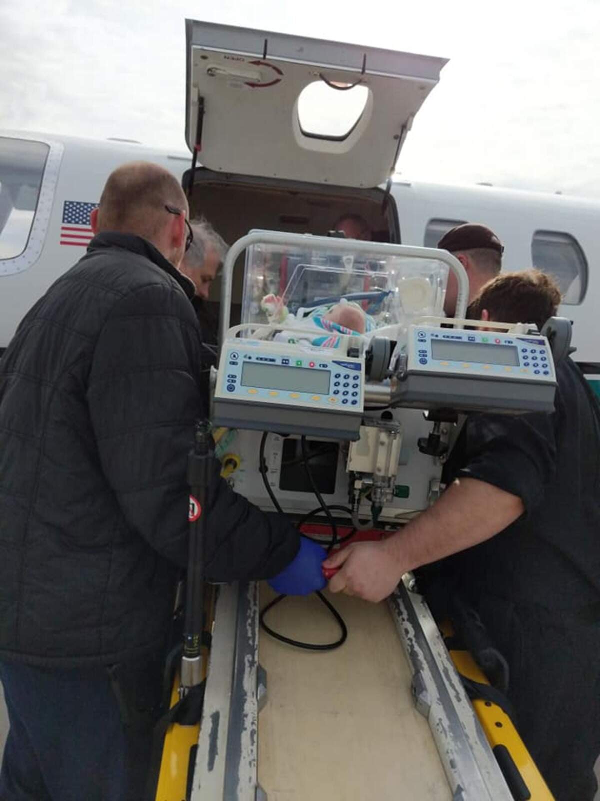 Medical personnel board Treyton onto a plane to fly him from the NICU in Wisconsin down to Savannah.