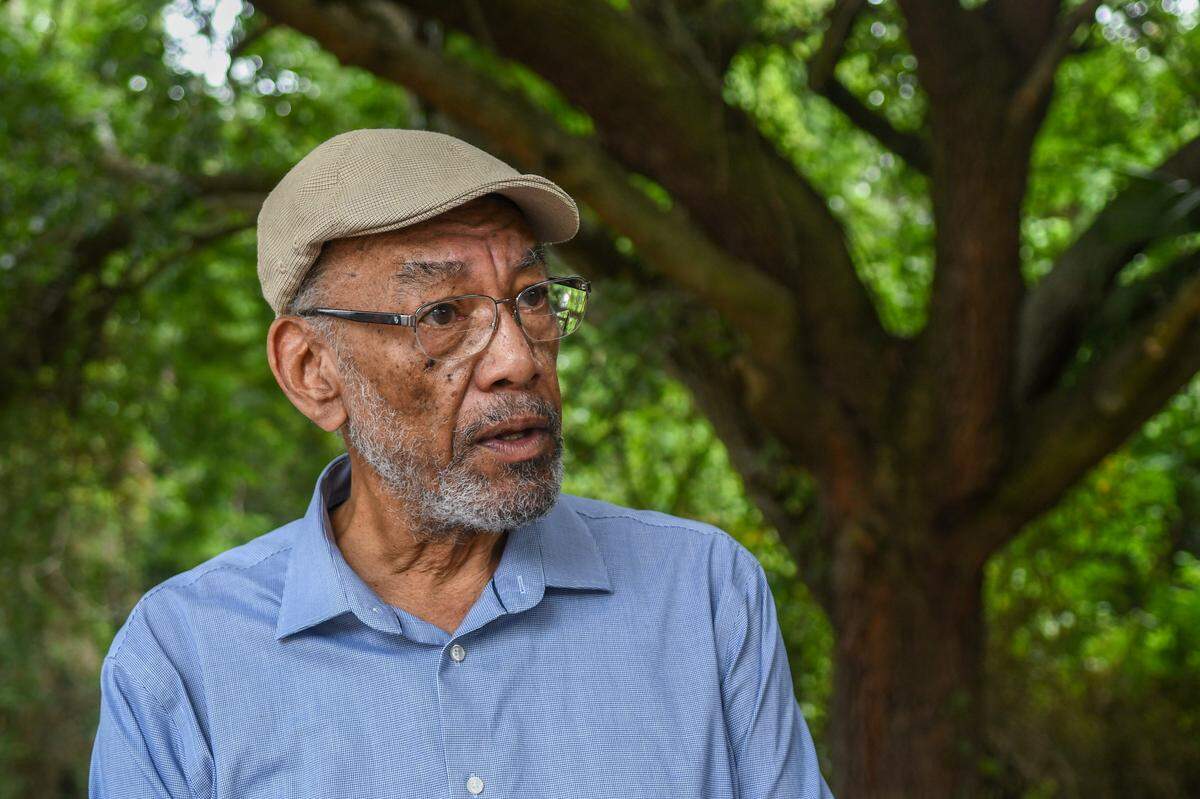Robert Patterson, a resident of Savannah, Ga., talks about the business his father Alexander Patterson opened in 1954 while standing under the shade of a majestic live oak on July 16, 2024 on Hilton Head Island. The building will likely be razed as part of the plan to widen William Hilton Parkway to six lanes. “This is the oldest, continuous operating business on Hilton Head Island,” Patterson said while talking about his family’s property. The building currently houses Willie Young’s Upholstery and Fabric.