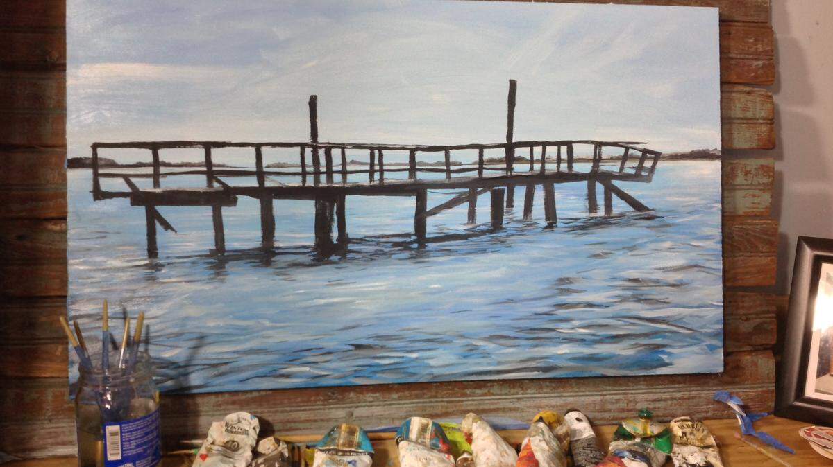 A photograph of "The Lonely Dock at Freeport," an oil-on-art-board painting by Bluffton artist Pierce Giltner. The painting is one possible piece Giltner plans to display at an artist reception at Cahill's Market. A date has not been set.