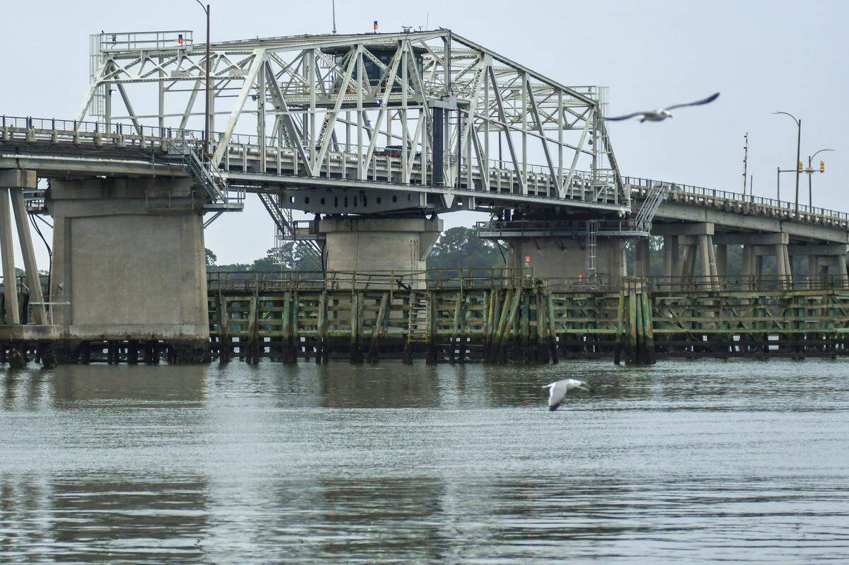 Sea gulls fly in front of the Richard V. Woods Memorial Bridge as pictured on Dec. 5, 2022, the last remaining swing bridge in Beaufort County.