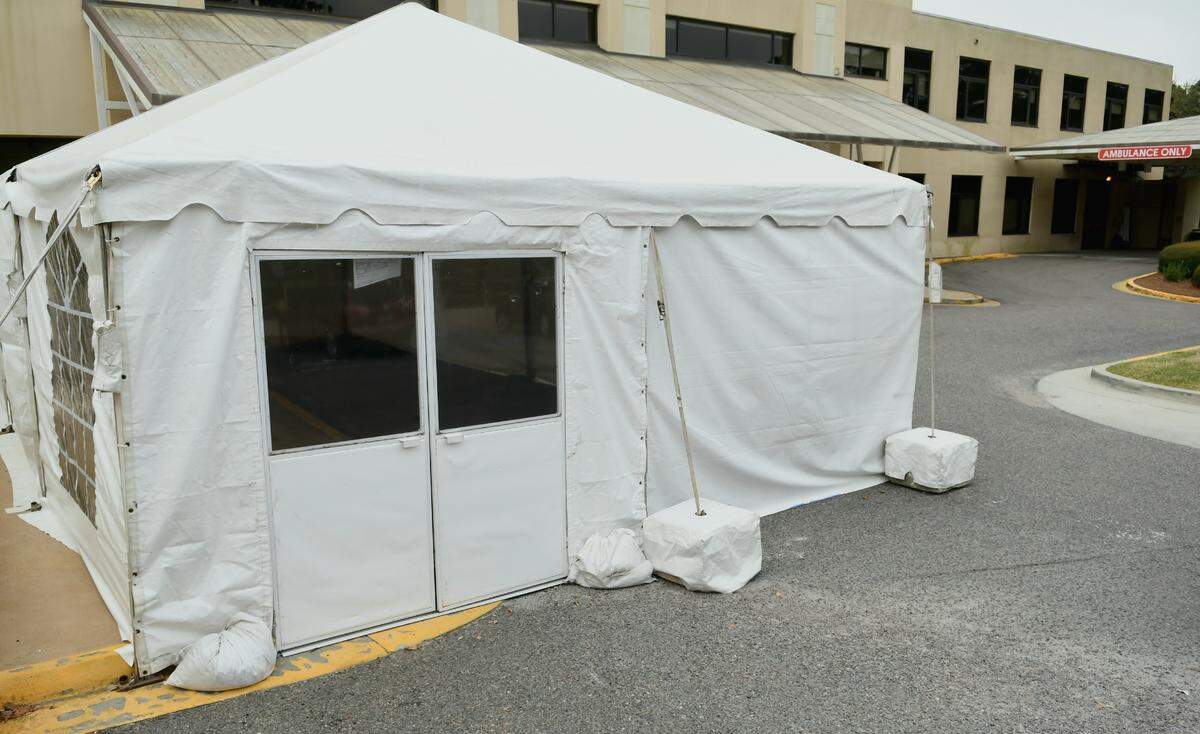 A pre-treatment tent, likely for an influx of potential COVID-19 cases, has been set up outside of Hilton Head Hospital’s emergency entrance as seen on Wednesday, March 18, 2020.