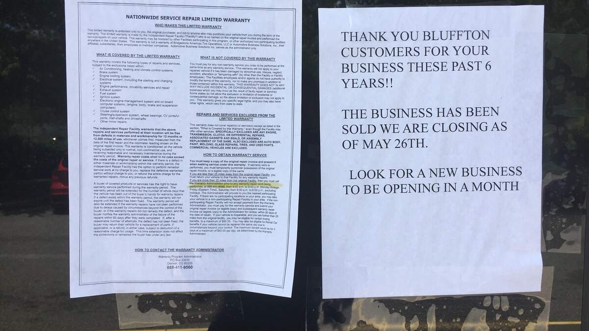 A note on the door of Bluffton Auto & Tire announces the business is closed.