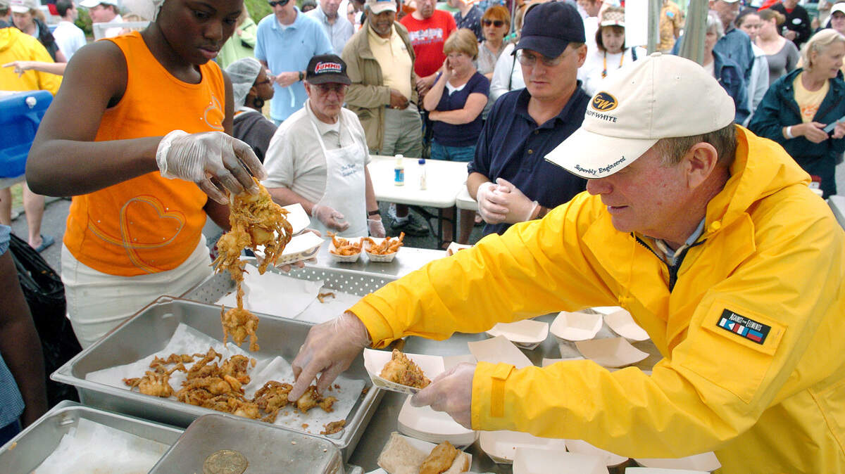 In this file photo, employees of Port Royal Seafood hustle to keep the fried soft shell crab moving during the  Seventh Annual Soft Shell Crab Festival in downtown Port Royal Saturday afternoon.