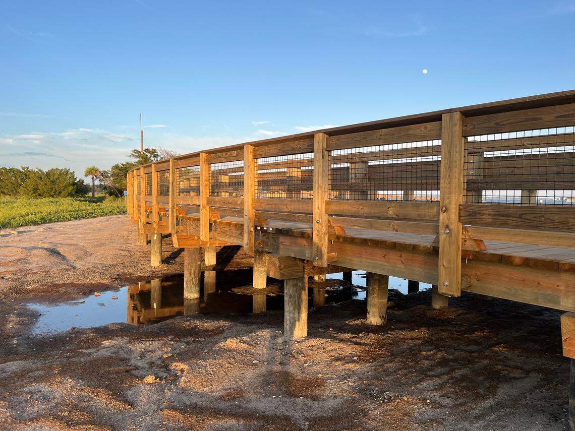 An area affected by tides, where the marsh meets Battery Creek, can be rough traveling for those trying to reach Sands Beach. A new causeway that’s now open provides passage over the water and rough terrain.