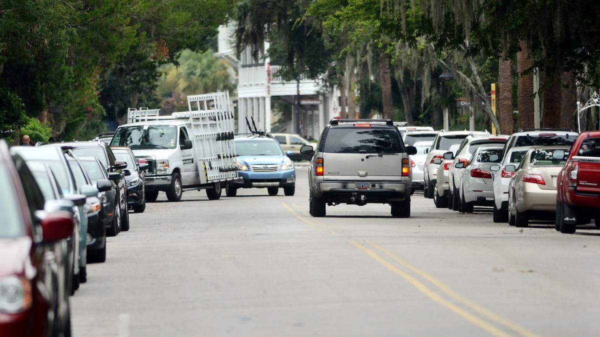 Traffic crawls between rows of parked cars on Calhoun Street in Old Town Bluffton on Friday. To deal with the parking shortage in Old Town, Bluffton approved a plan in June to add as many as 100 new parking spaces.