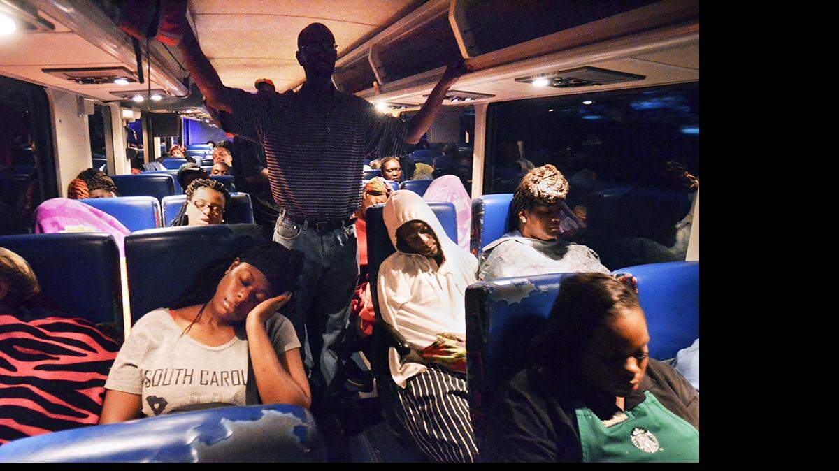 Palmetto Breeze riders fortunate enough to be seated — including Laquia Paterson, foreground, left — sleep during their July 27, 2016, pre-dawn bus ride from Allendale to Bluffton and Hilton Head Island. Paterson was going to a job interview at Disney’s Hilton Head Island Resort. 