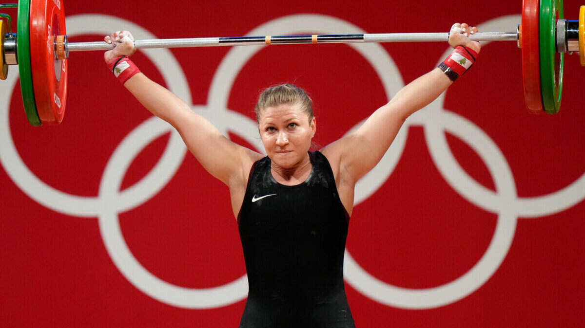 Mahassen Hala Fattouh of Lebanon competes in the women’s 76kg weightlifting event, at the 2020 Summer Olympics, Sunday, Aug. 1, 2021, in Tokyo, Japan.