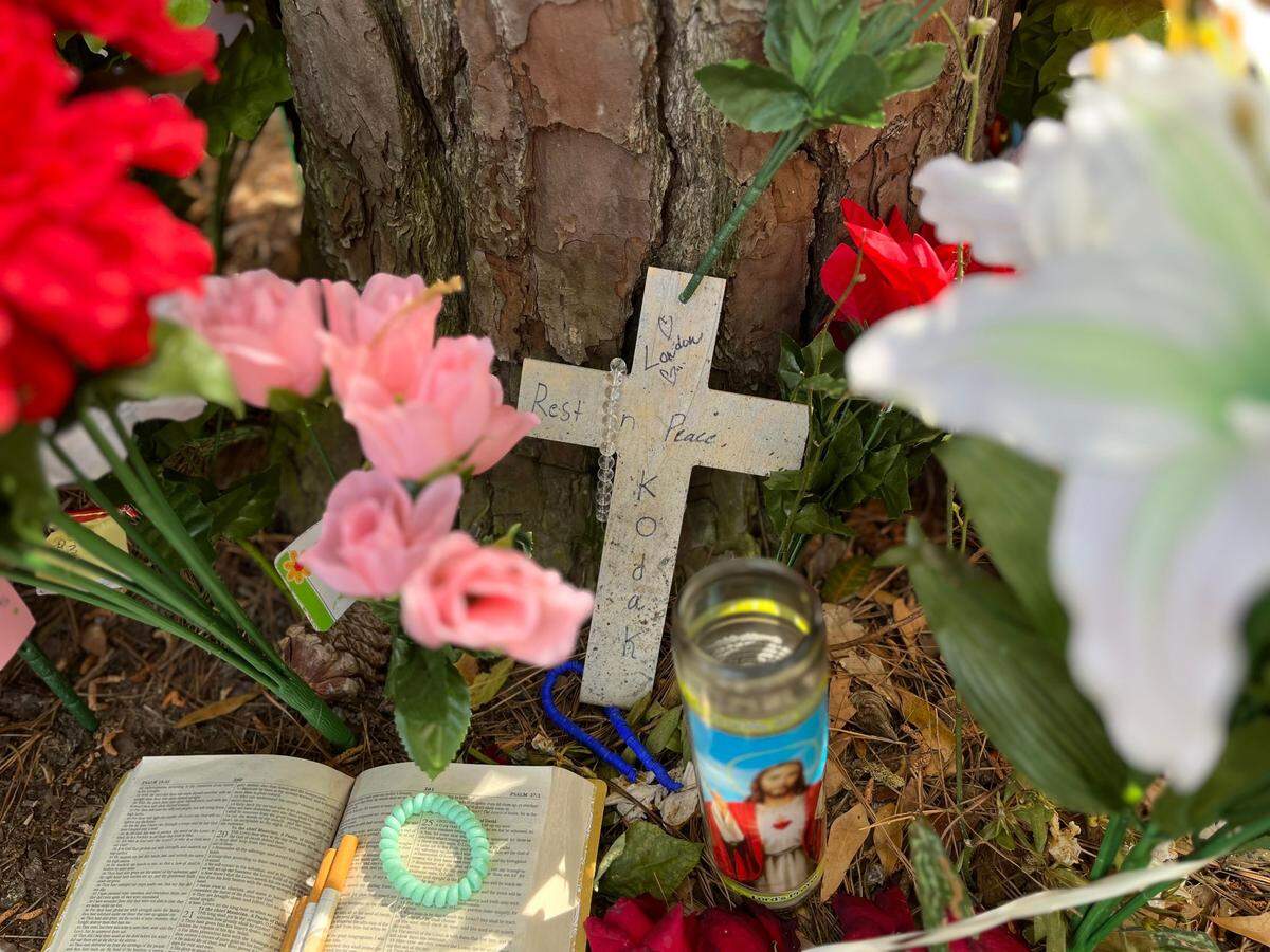A cross with the nickname of Darryal Grant Jr. was found at a makeshift memorial where his body was found on March 16.