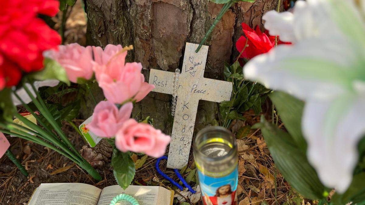 A cross with the nickname of Darryal Grant Jr. was placed at a makeshift memorial where his body was found on March 16.