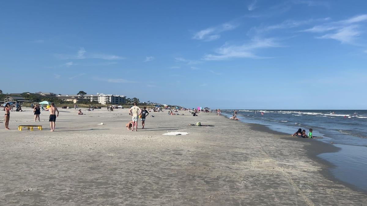 Beachgoers on Coligny Beach in Hilton Head.