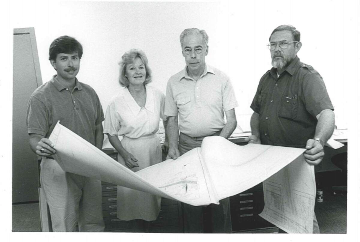 Scott Liggett (left) and his colleagues in the engineering department in an undated photo from The Island Packet archives.