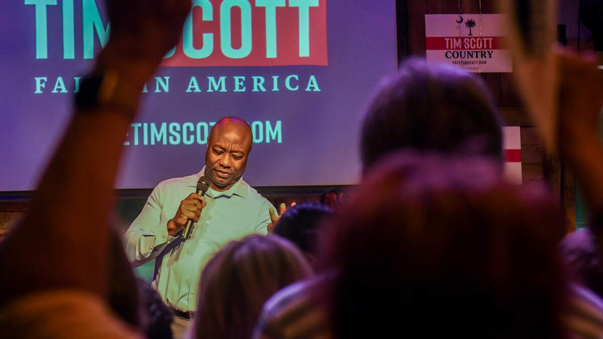 A crowd of at least 200 hundred people cheer and applause after GOP presidential candidate Sen. Tim Scott takes the stage for his campaign stop on Friday, Oct. 6, 2023, at Corner Perk Brunch Café in Old Town Bluffton.