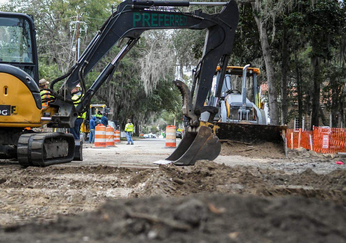 An excavator sits idle at the end of Calhoun Street on Thursday Jan. 23, 2020, as workers disband for lunch as work continues on Bluffton’s Wright Family Park. Workers are adding more parking across from the Church of the Cross as well as improving drainage and building new sidewalks.