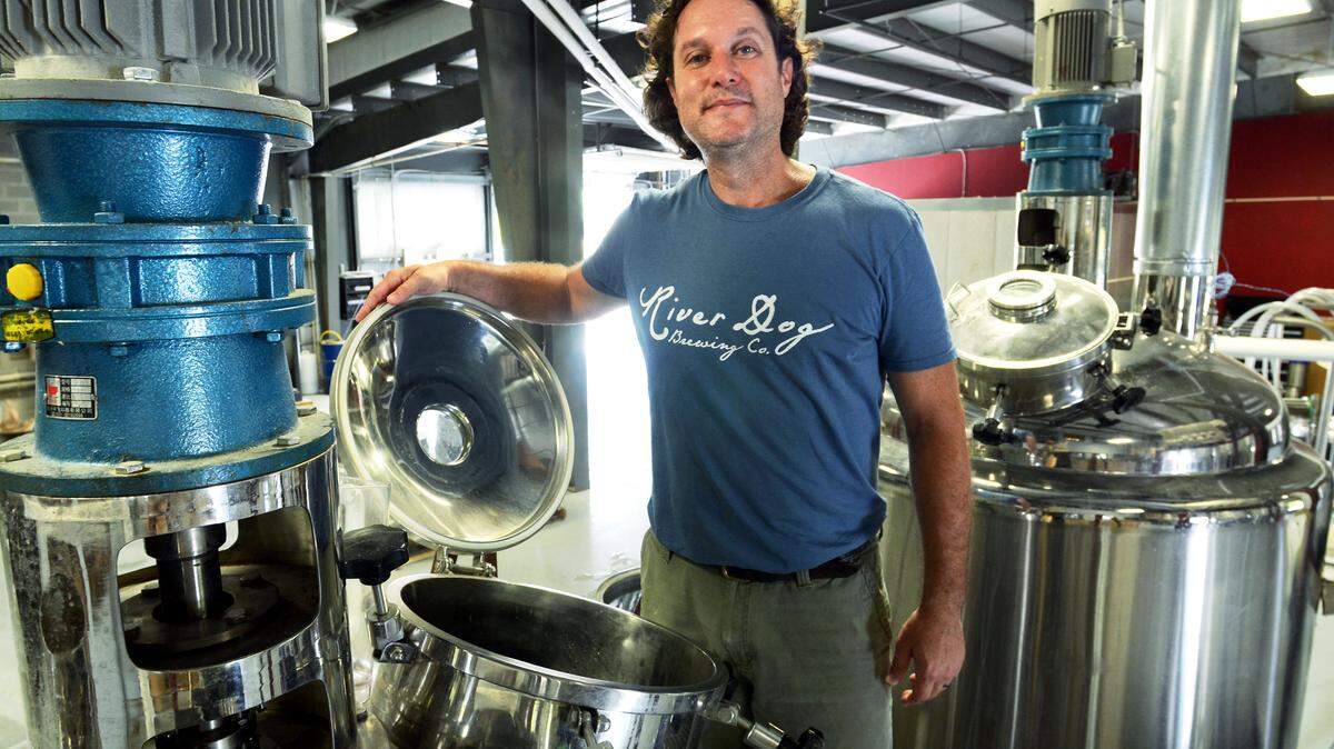 Brewer James Brown is photographed at River Dog Brewing in Okatie on Thursday.